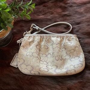 Coach metallic silver wristlet
